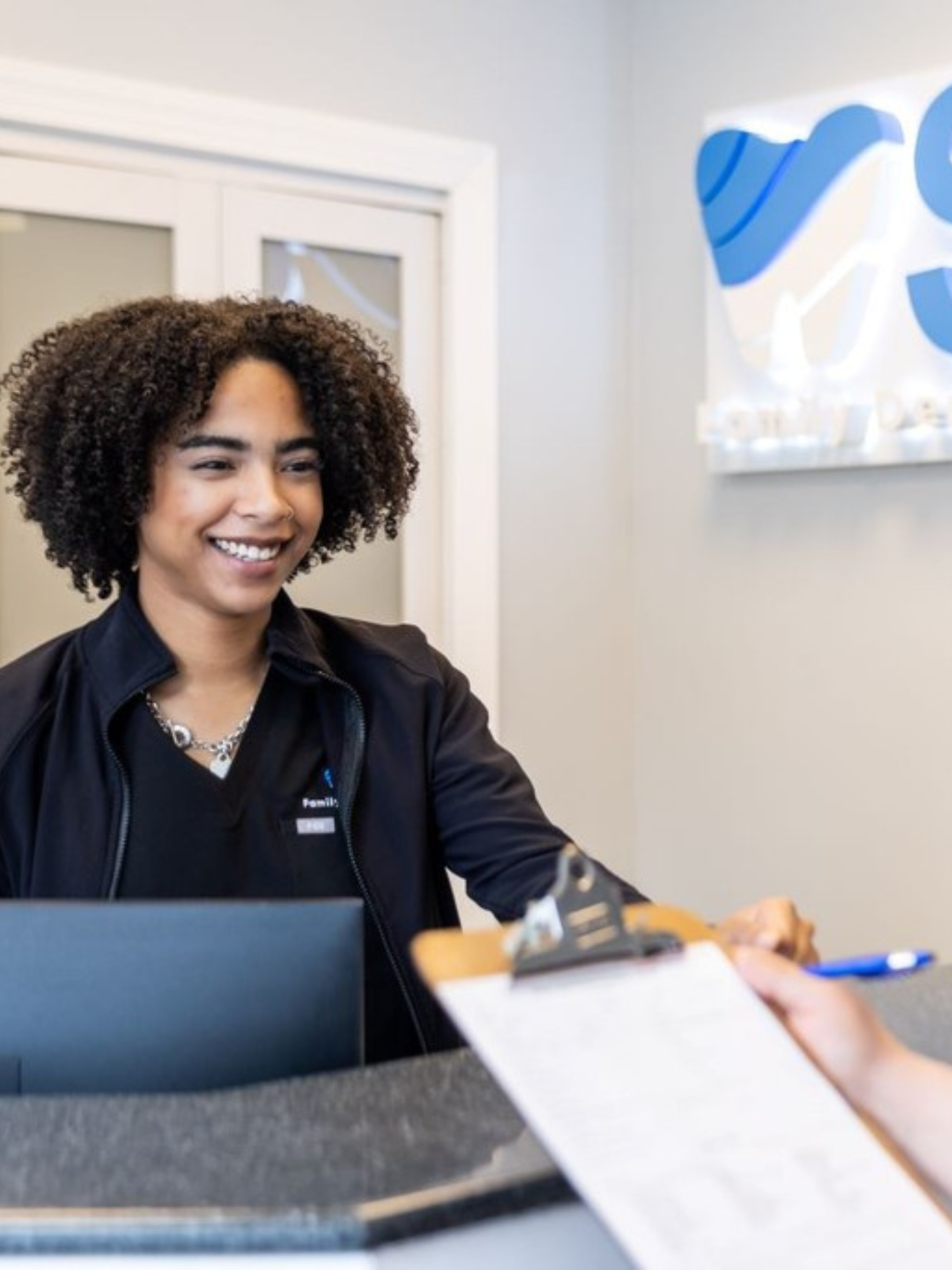 staff smiling patient interaction